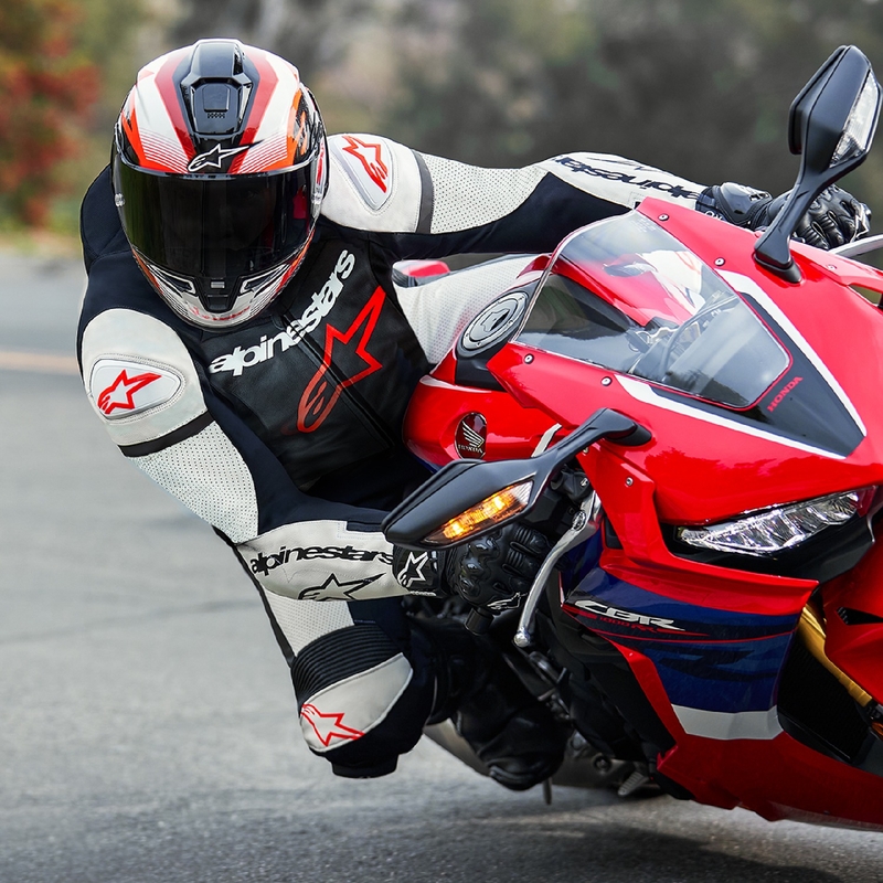 Alpinestars GP Force Lurv флуо червено-бяло-черен кожен костюм от една част за мотоциклет